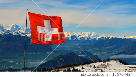 Snowy Peaks Under Bright Sky, Panoramic View Of Icy Peaks Beneath Bright Blue Sky With Scenic Trail Snowy Peaks Under Bright Sky, Panoramic View Of Icy Peaks Beneath Bright Blue Sky With Scenic Trail 135764424
