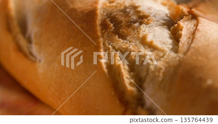 Artisan Style Loaf With Crispy Crust And Tender Insides Reflects Warm Bakery Memories And Daily Rituals 135764439