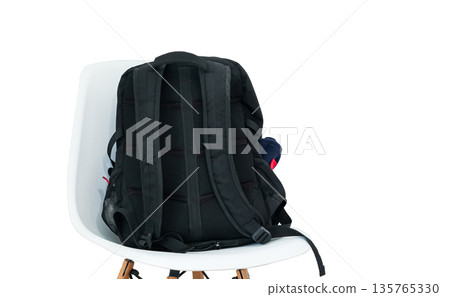 Everyday backpack for laptop and travel. Concept of getting ready for school, university, or office. Minimalist interior and travel readiness 135765330