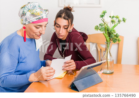 Women volunteers organizing breast cancer association at home 135766490