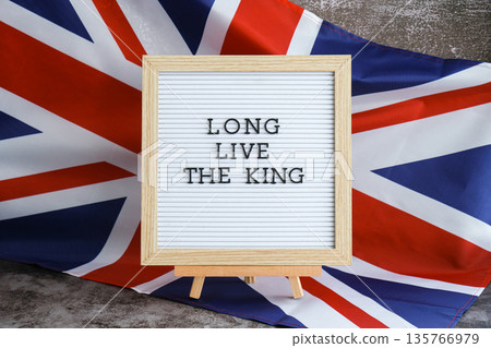 LONG LIVE THE KING Patriotic scene with signboard and waving flag message UNITED KINGDOM with national colors Festive background with British flag and message board with text Great Britain 135766979