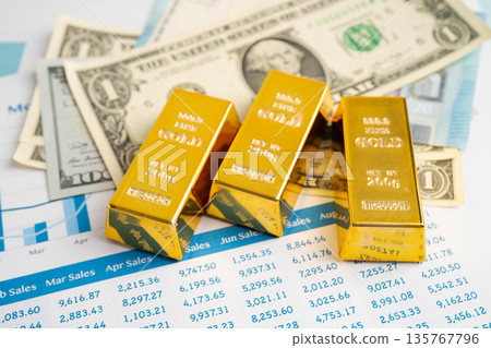 Gold bars with US dollar and Euro banknote money, finance trading investment business currency. Gold bars with US dollar and Euro banknote money, finance trading investment business currency. 135767796