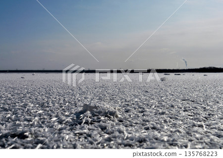 "Frost Flowers" spread across the frozen lake surface against the backdrop of a clear winter sky at Lake Utonai in January "Frost Flowers" spread across the frozen lake surface against the backdrop of a clear winter sky at Lake Utonai in January 135768223