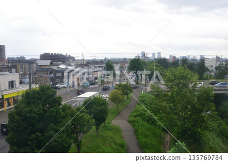 JR Hokkaido Sassho Line: Scenery from the train window between Sapporo Station and Shinkotoni Station (cloudy in the summer of 2023) 135769784
