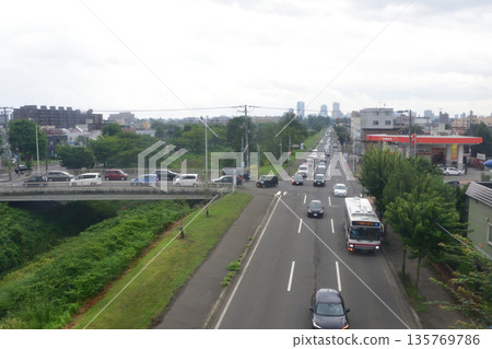 JR Hokkaido Sassho Line: Scenery from the train window between Sapporo Station and Shinkotoni Station (cloudy in the summer of 2023) 135769786