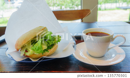 Lunch: bagel sandwich and coffee at the cafe 135770301