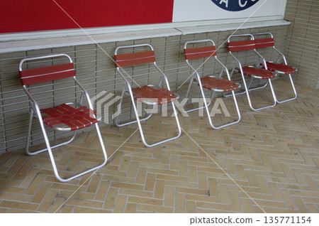 A folding chair in a corner of the airport's Wi-Fi-equipped restricted area 135771154