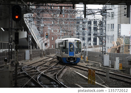 A train arriving at Nishitetsu Fukuoka Station in 2016 A train arriving at Nishitetsu Fukuoka Station in 2016 135772012