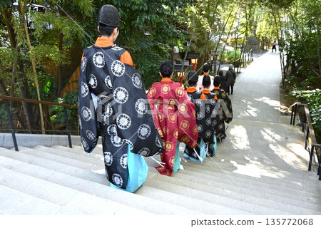 Priests and shrine maidens in the shrine grounds Priests and shrine maidens in the shrine grounds 135772068