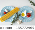 Spaghettini on a blue plate 135772965