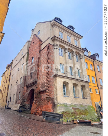 Historic building on cobblestone street in old town of Warsaw, Poland Historic building on cobblestone street in old town of Warsaw, Poland 135774027
