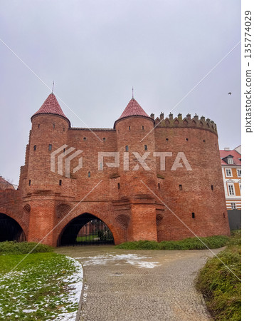 Walking around the Warsaw Barbican on a cloudy day in winter 135774029
