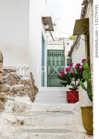 Narrow streets of Anafiotika area in ancient Athens Narrow streets of Anafiotika area in ancient Athens 135774191