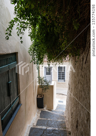 Narrow streets of Anafiotika area in ancient Athens Narrow streets of Anafiotika area in ancient Athens 135774198