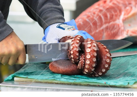 Octopus being cut into pieces 135774456