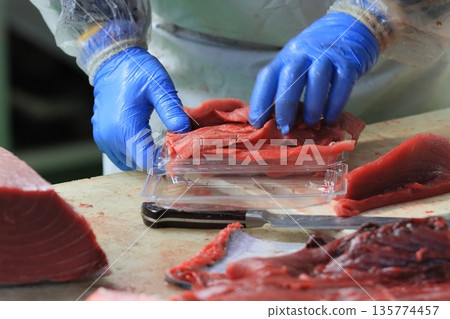 Fresh raw tuna lined up in packs 135774457