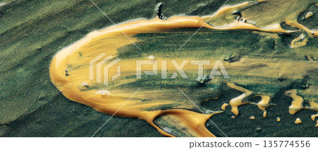 Abstract Golden Yellow Paint Strokes on Dark Green Textured Surface Background 135774556