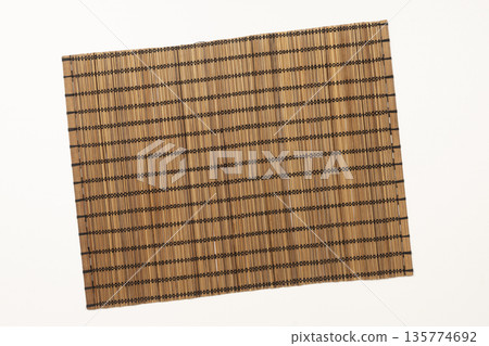 a small placemat made from bamboo canes a small placemat made from bamboo canes 135774692