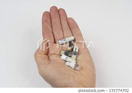 Some LED bulbs on the palm of the hand 135774702