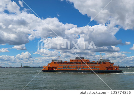 Staten Island Ferry on the bay on a sunny day with clouds and blue sky in New York, NY, USA. August 27, 2025 Staten Island Ferry on the bay on a sunny day with clouds and blue sky in New York, NY, USA. August 27, 2025 135774836