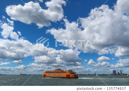 Staten Island Ferry on the bay on a sunny day with clouds and blue sky in New York, NY, USA. August 27, 2025 Staten Island Ferry on the bay on a sunny day with clouds and blue sky in New York, NY, USA. August 27, 2025 135774837