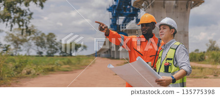 Engineer survey team checking construction project inspection work construction site Engineer survey team checking construction project inspection work construction site 135775398