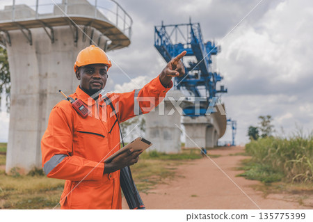 Engineer survey team checking construction project inspection work construction site Engineer survey team checking construction project inspection work construction site 135775399