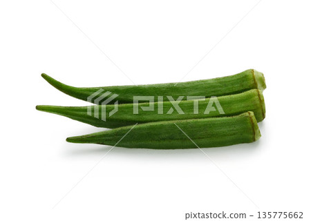 Green Okras isolated on the white background. Okra clipping path. Green Okras isolated on the white background. Okra clipping path. 135775662