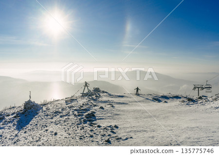 A skier admires the winter scenery. Sheregesh ski resort. cold natural landscape, activity 135775746