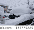 Snow piled up on the car 135775885