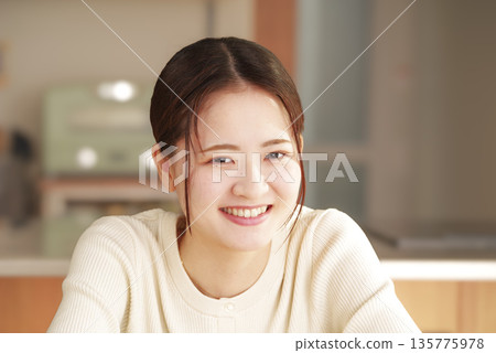 Smiling and positive female portrait 135775978