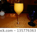Orange juice in a wine glass 135776363