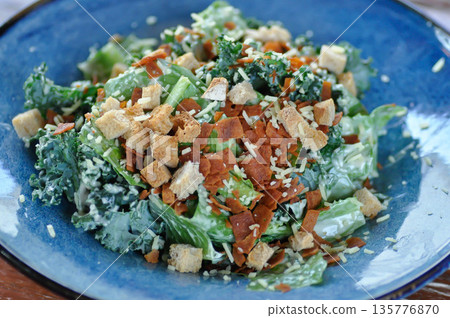 caesar salad or vegetable salad with bacon 135776870