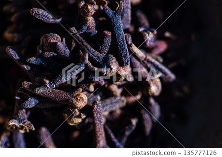 Cloves spice in the ceramic bowl Cloves spice in the ceramic bowl 135777126
