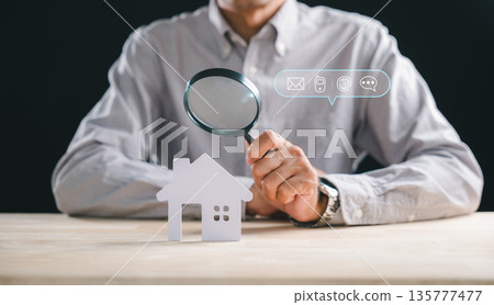 Man performs real estate appraisal inspecting house home property using magnifying glass, searching details for accurate valuation, offering inspector contact for thorough property inspection service Man performs real estate appraisal inspecting house home property using magnifying glass, searching details for accurate valuation, offering inspector contact for thorough property inspection service 135777477