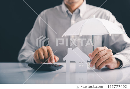 Protect your home, make sure insured, calculate financial insurance using an umbrella for complete assistance, and know your contents are always insured with this safe investment concept 135777492