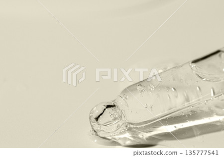 Transparent cosmetic product for skin care. Copy space Transparent cosmetic product for skin care. Copy space 135777541