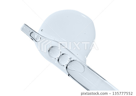 A sample of facial serum or gel or moisturizer with a pipette. Isolated on white. A sample of facial serum or gel or moisturizer with a pipette. Isolated on white. 135777552