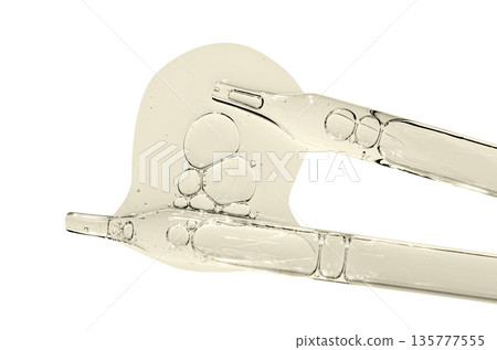 A sample of facial serum or gel or moisturizer with a pipette. Isolated on white. 135777555