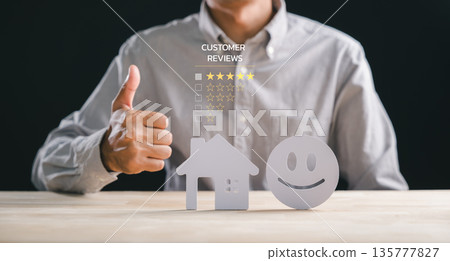 Real estate customer reviews receive person thumbs up, indicating high satisfaction and best star feedback for property home construction concept, demonstrating positive service results 135777827