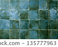 Green ceramic tile background. Old vintage ceramic tiles in green to decorate the kitchen or bathroom 135777963