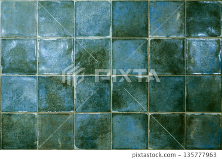 Green ceramic tile background. Old vintage ceramic tiles in green to decorate the kitchen or bathroom 135777963