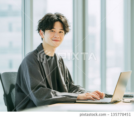 Japanese businessman working on a laptop 135778451