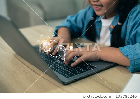 Child using AI technology on laptop for education and future learning. Young girl exploring artificial intelligence icons, digital communication, and online innovation on computer. Child using AI technology on laptop for education and future learning. Young girl exploring artificial intelligence icons, digital communication, and online innovation on computer. 135780240