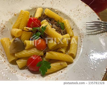 Rotini pasta with meat, mushrooms and tomatoes Rotini pasta with meat, mushrooms and tomatoes 135781328