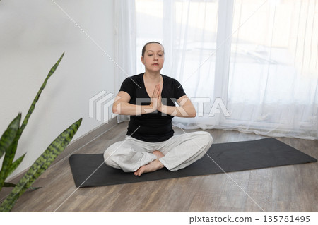 Yoga Session in a Bright Room With Natural Light in the Afternoon 135781495