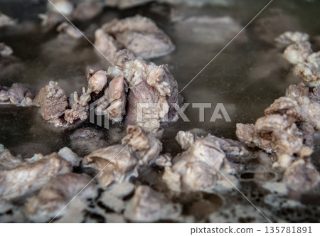 Closeup of Boiling pork rip soup in hot in pot boiling water. 135781891