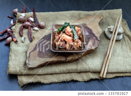Thai Spicy food, Spicy Stir Fried Deep Fish Fillet with Herbs vegetables in wooden bowl : in Thai language called "Pad Cha ". Thai Spicy food, Spicy Stir Fried Deep Fish Fillet with Herbs vegetables in wooden bowl : in Thai language called "Pad Cha ". 135781927