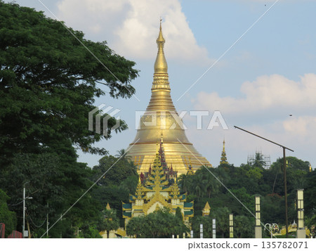 The gold dome of Shwedagon Pagoda behind trees in Yangon.JPG The gold dome of Shwedagon Pagoda behind trees in Yangon.JPG 135782071