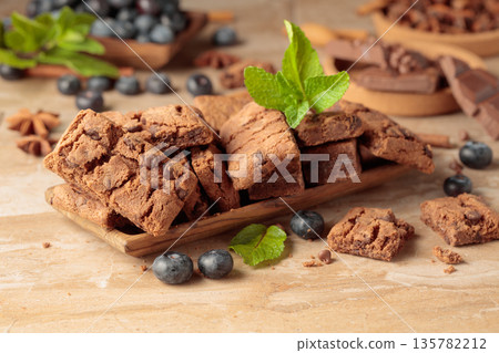 Brownie with fresh blueberries and mint. Brownie with fresh blueberries and mint. 135782212